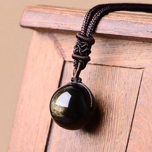 Golden obsidian “sphere” pendant